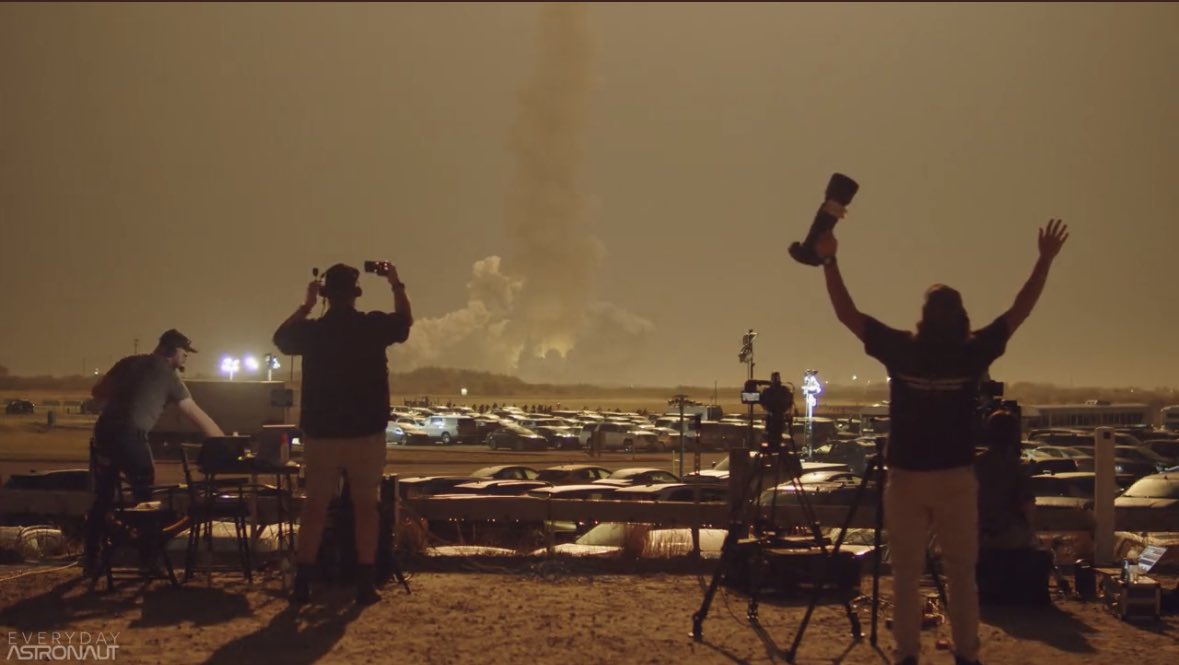 A behind the scenes shot during the Everyday Astronaut livestream of Artemis 1. The team looks out towards SLS lifting off from pad 39B.
